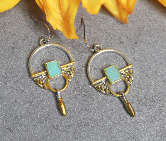 Silver and gold toned earrings with blue Stone