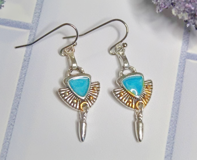 Silver earrings with turquoise stones and gold accents